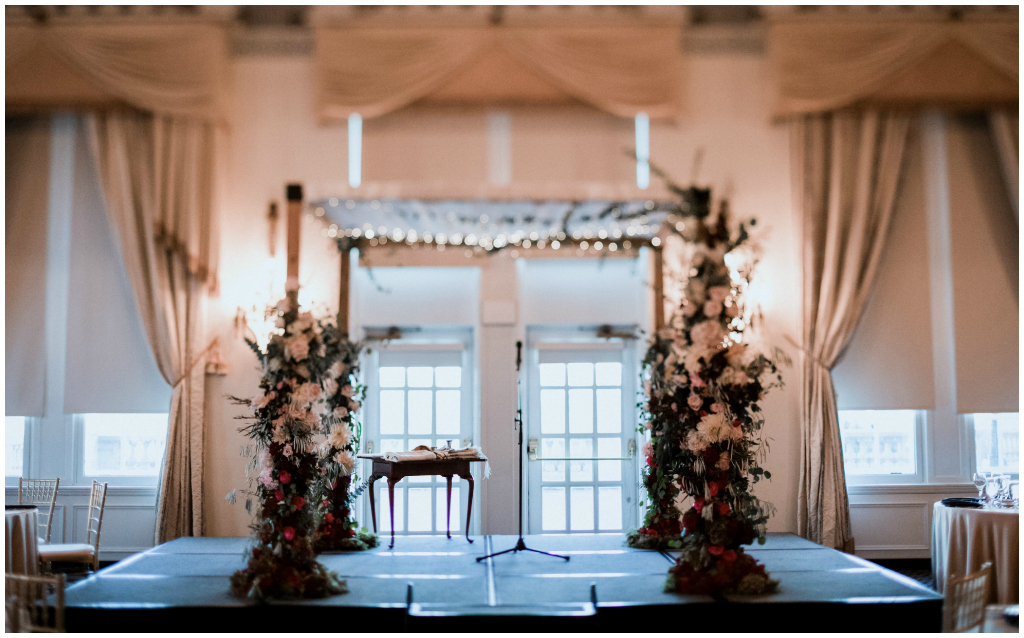 Creative chuppah design flowers greenery